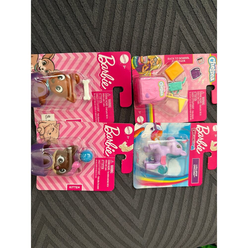 Barbie 7 pack 2 ken clothes, 1 barbie clothes 3 pets and 1 accesories